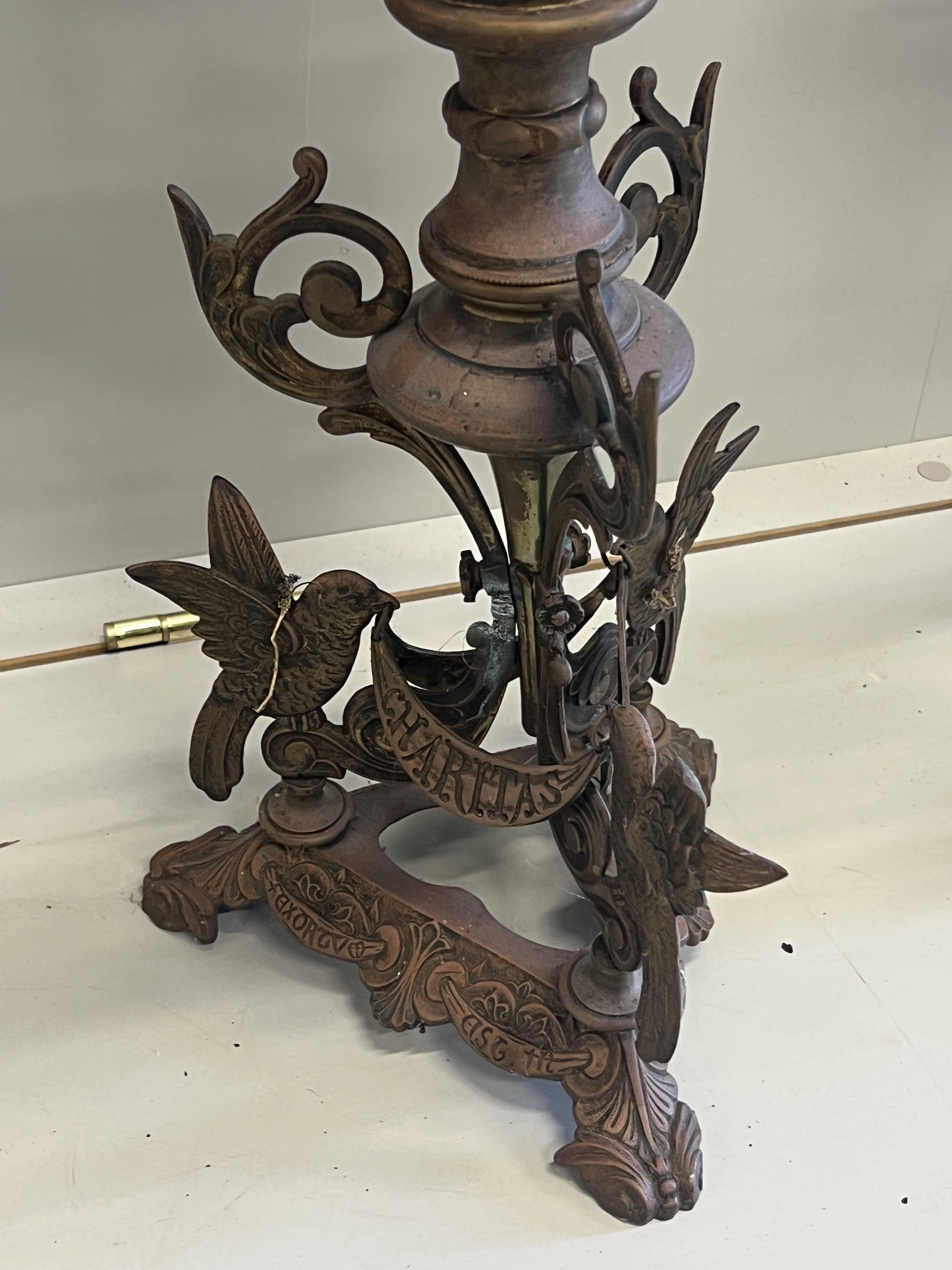 A pair of Gothic style seven branch cast metal candelabra, height 80cm